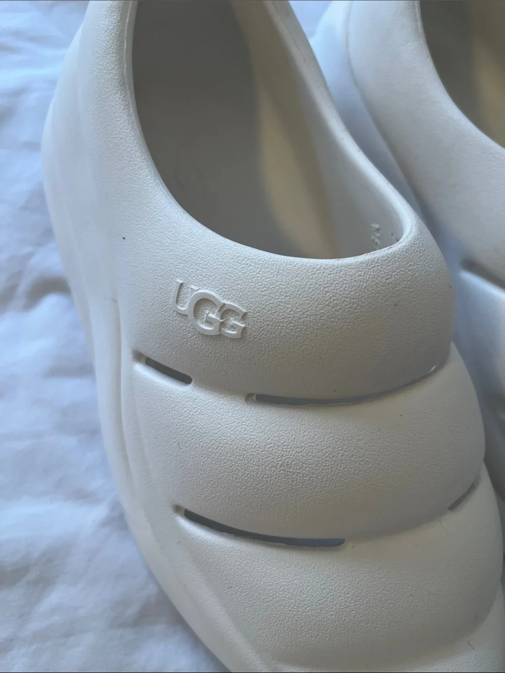 UGG women’s White Slip-On Foam Clog Sneakers